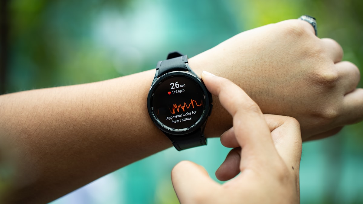 Close-up of a runner checking a GPS watch mid-workout
